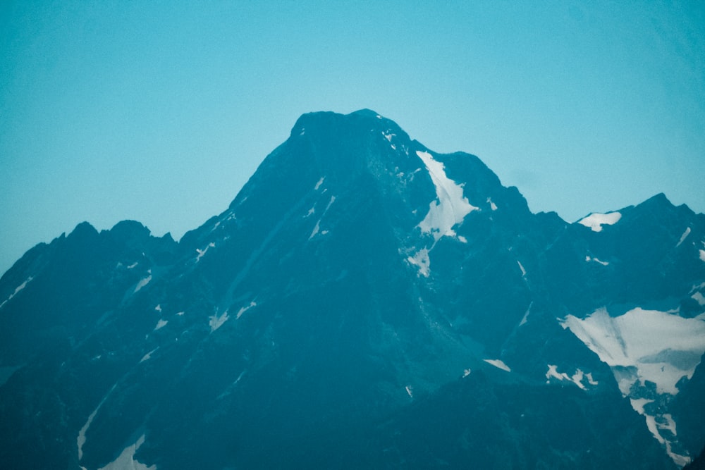 black and white mountain under blue sky during daytime