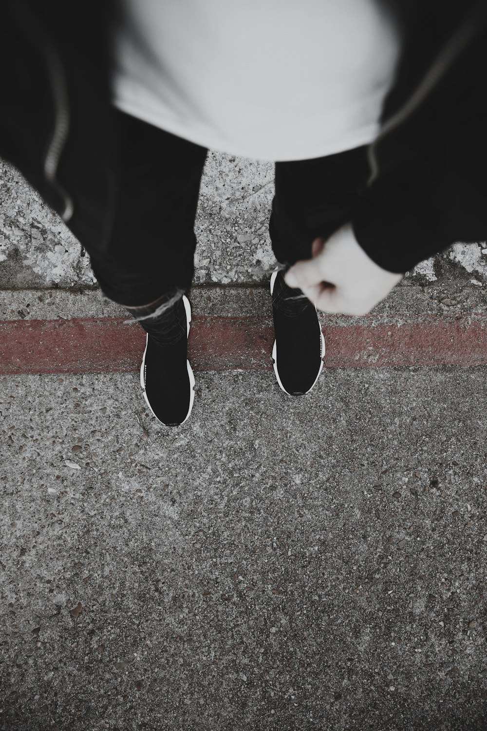 person in black pants and black shoes