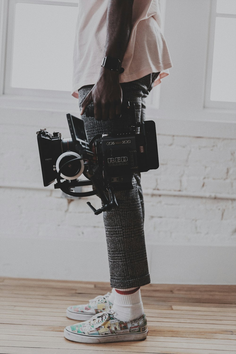 black dslr camera on black and white chevron textile