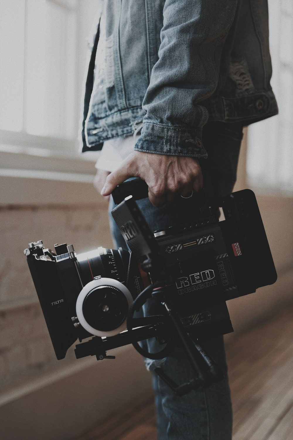 person holding black dslr camera