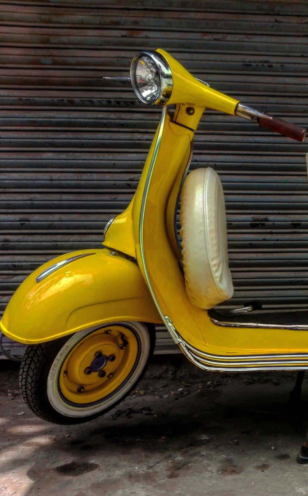 yellow and white motor scooter