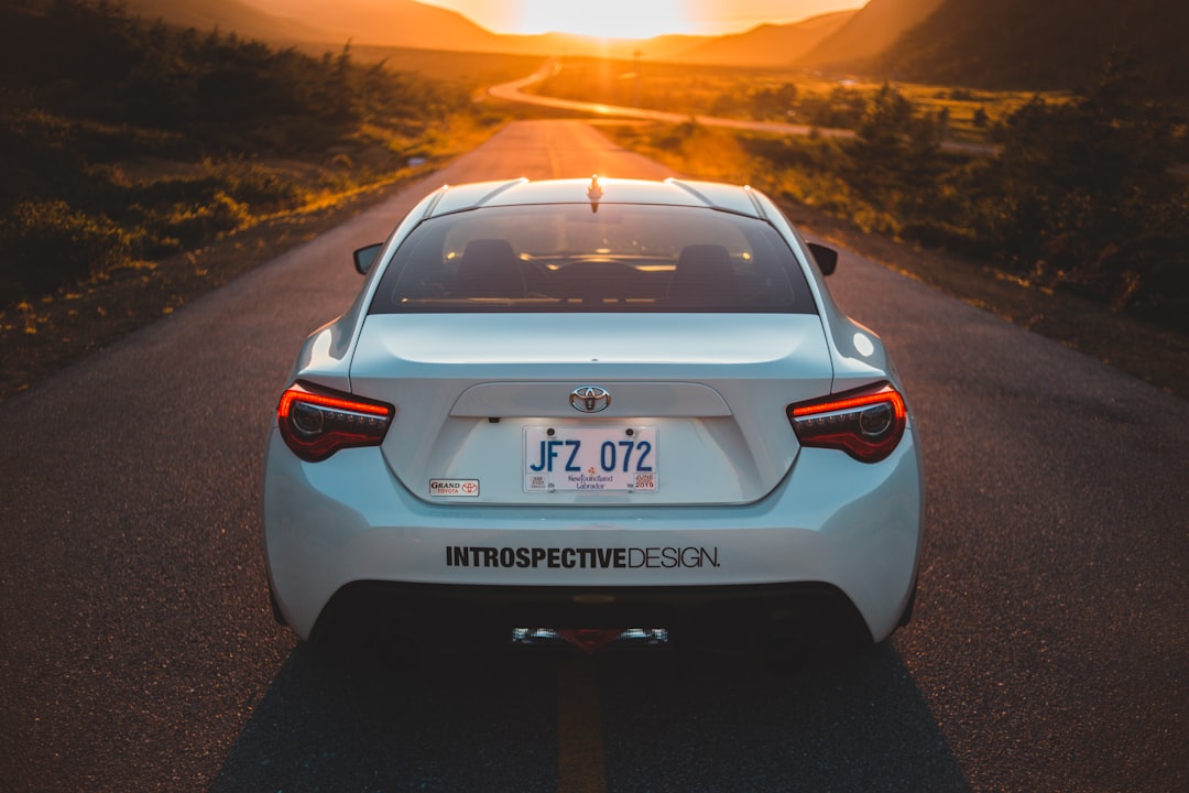 white bmw m 3 on road during sunset