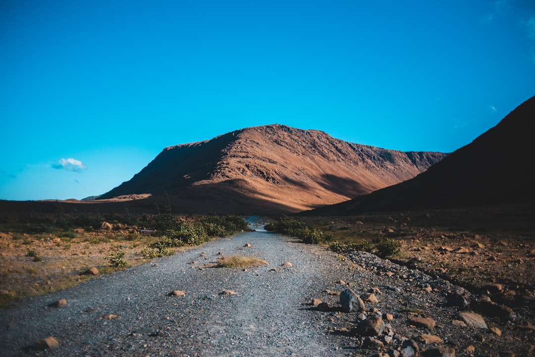 brown mountain under blue sky during daytime