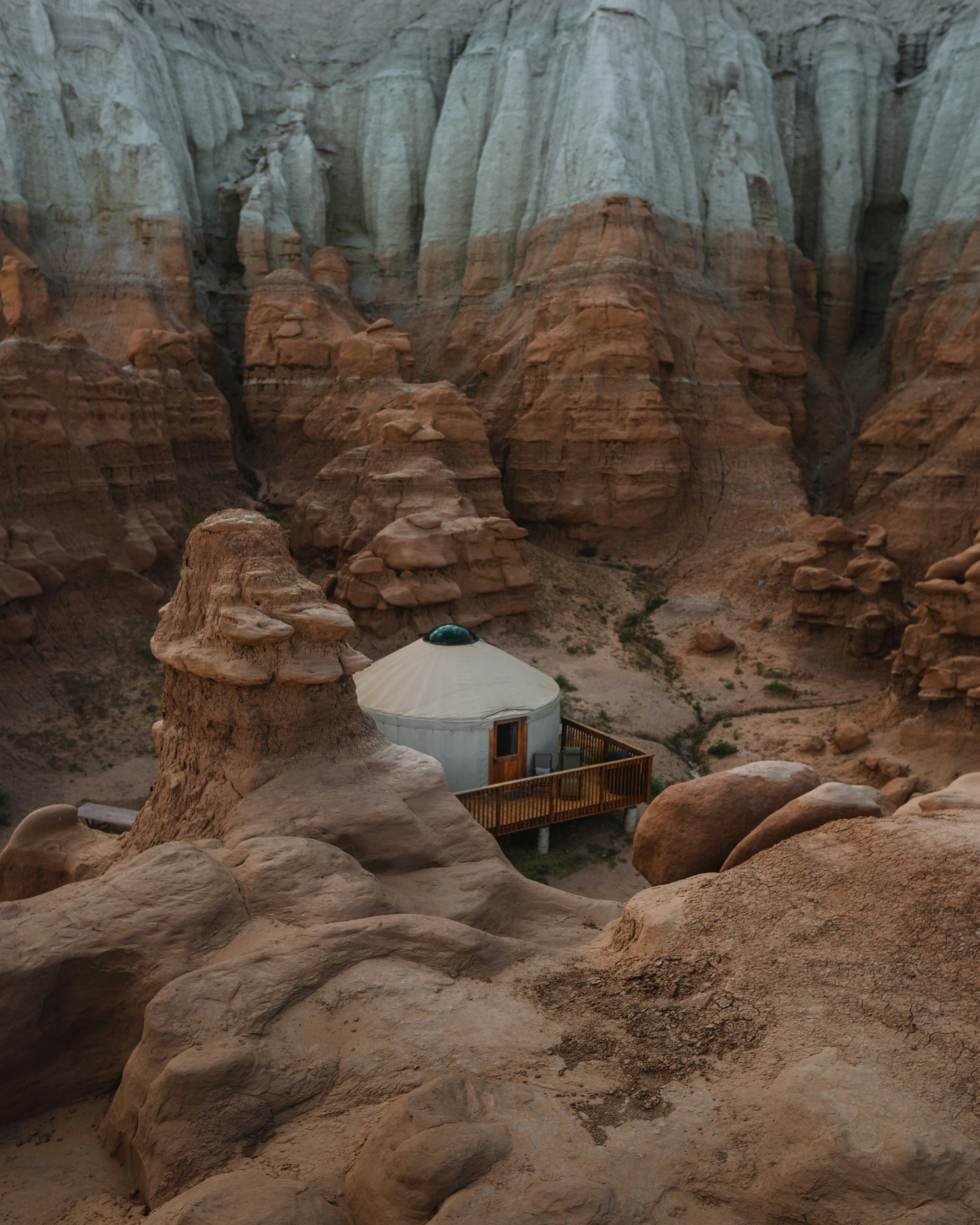 white and blue dome tent on brown rock formation during daytime