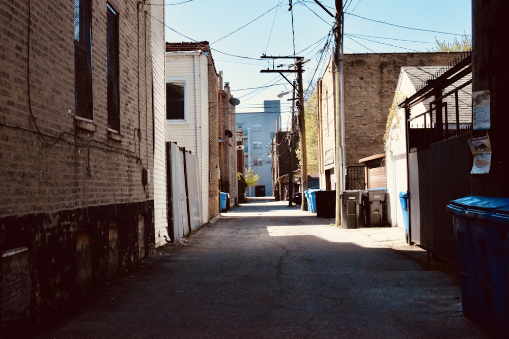 white car parked beside white concrete building during daytime