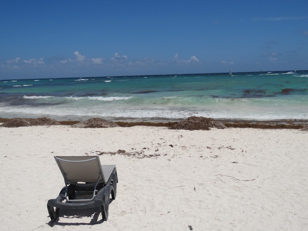 black and gray chair on beach during daytime