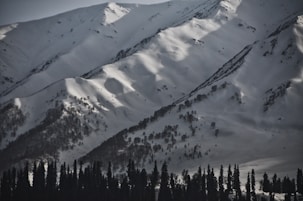 snow covered mountain during daytime