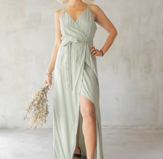 woman in green spaghetti strap dress