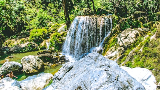 water falls in the middle of the forest in Mussoorie India