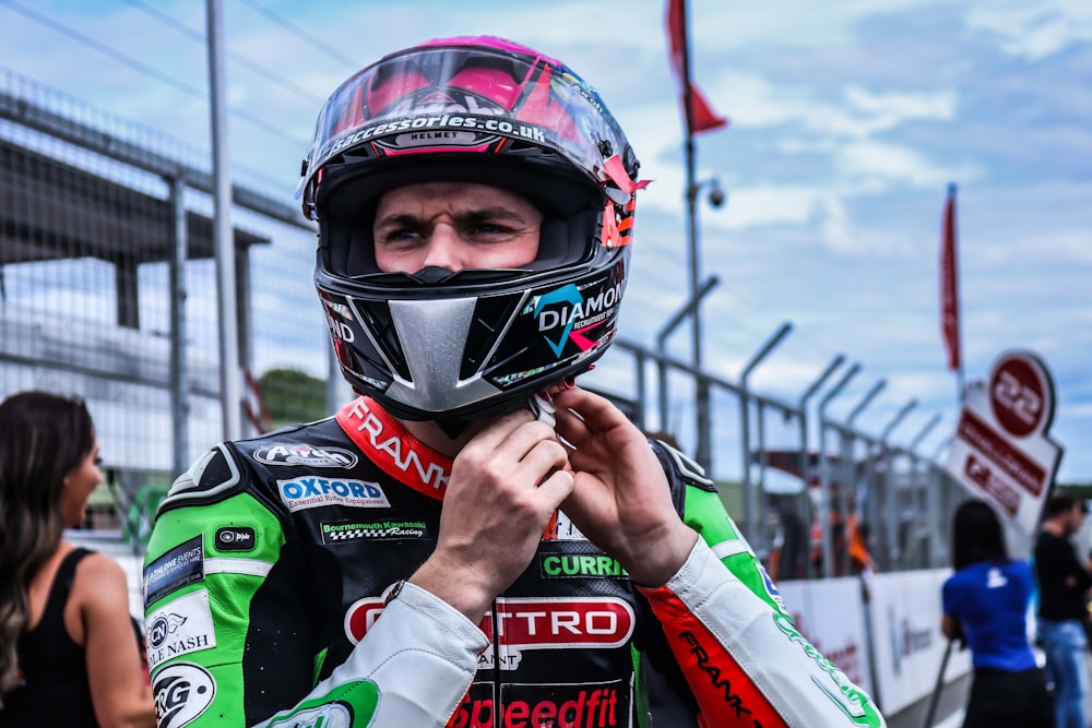 man in green and red helmet and white and red jacket