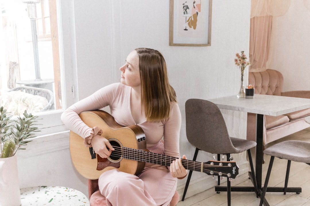 woman in pink long sleeve shirt sitting on black chair, A little Photoshoot for Sharon Anne - find her on iTunes and Spo