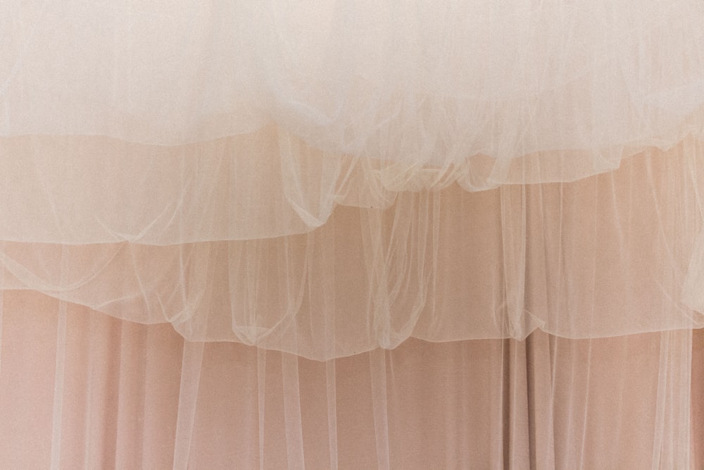 white sheer curtain on window