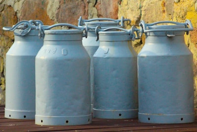 gray steel tank with white plastic cover