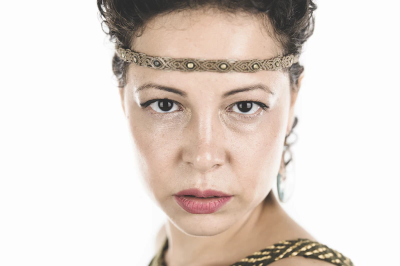 Woman in a gold and black top