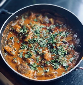 cooked food in black cooking pot