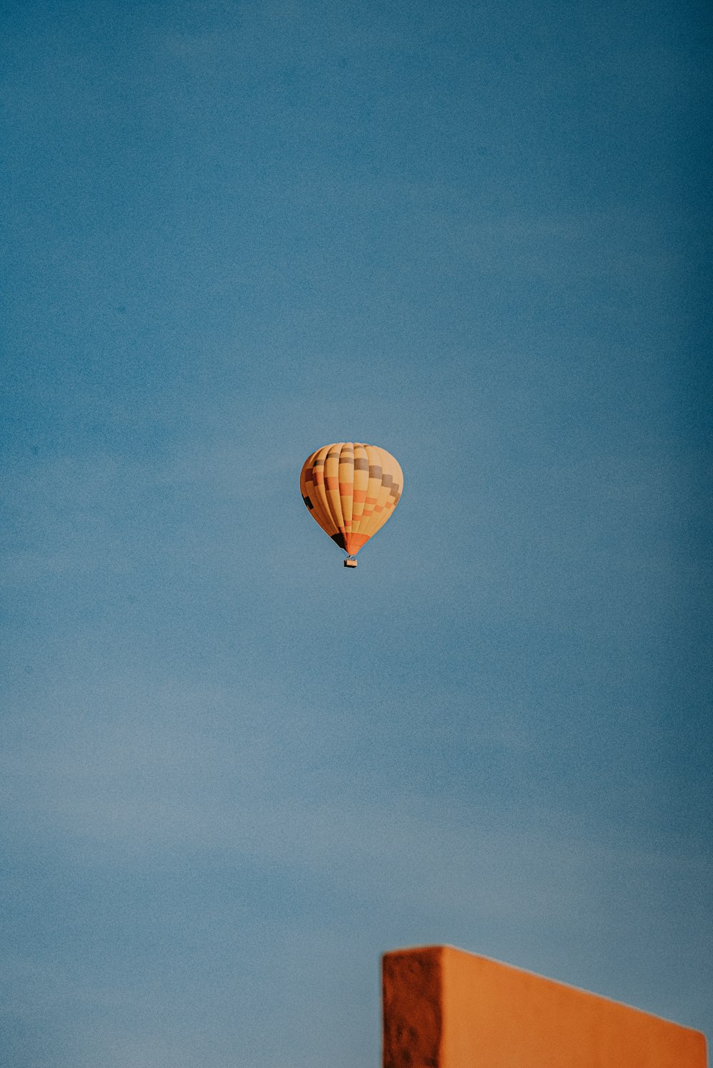 orange hot air balloon on sky