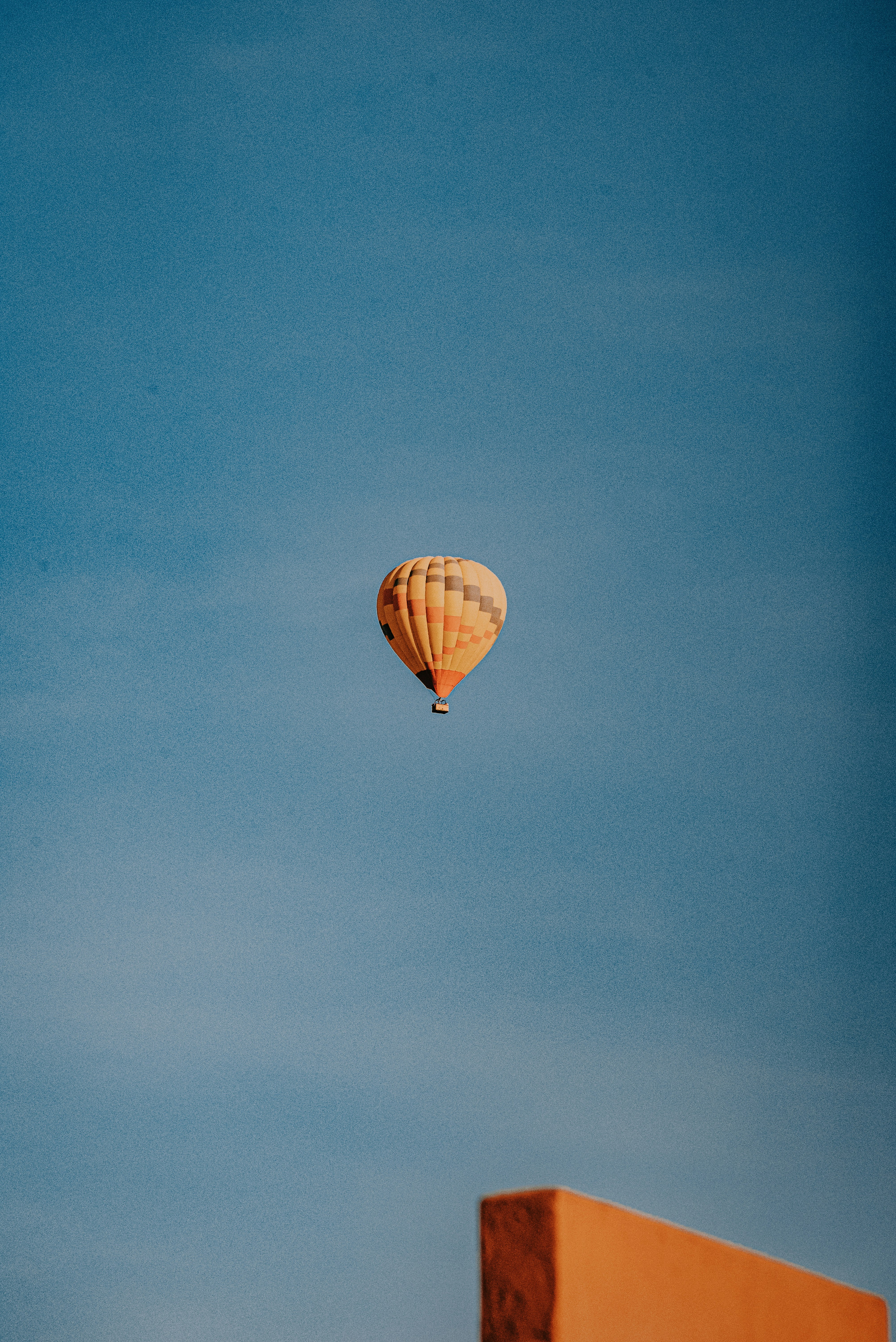 orange hot air balloon on sky