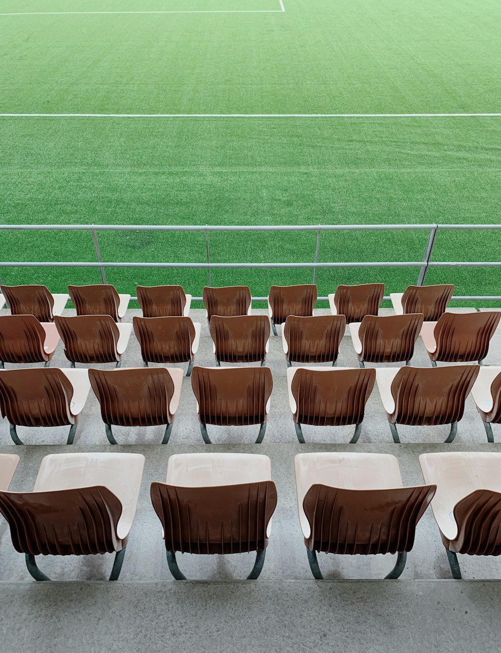 brown and gray chairs on green grass field during daytime