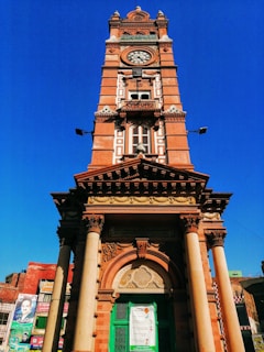 brown concrete building under blue sky during daytime