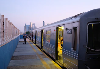 a train stopped at a train station next to a platform