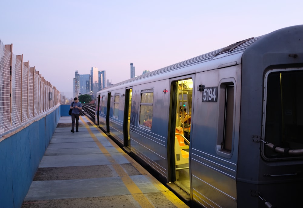 a train stopped at a train station next to a platform