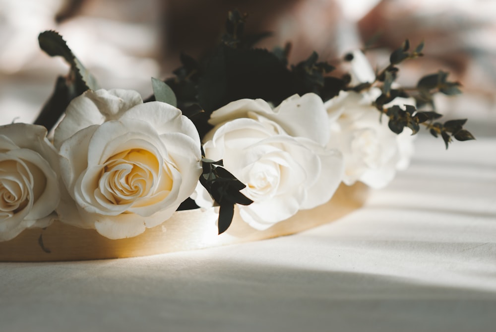 white roses on white table