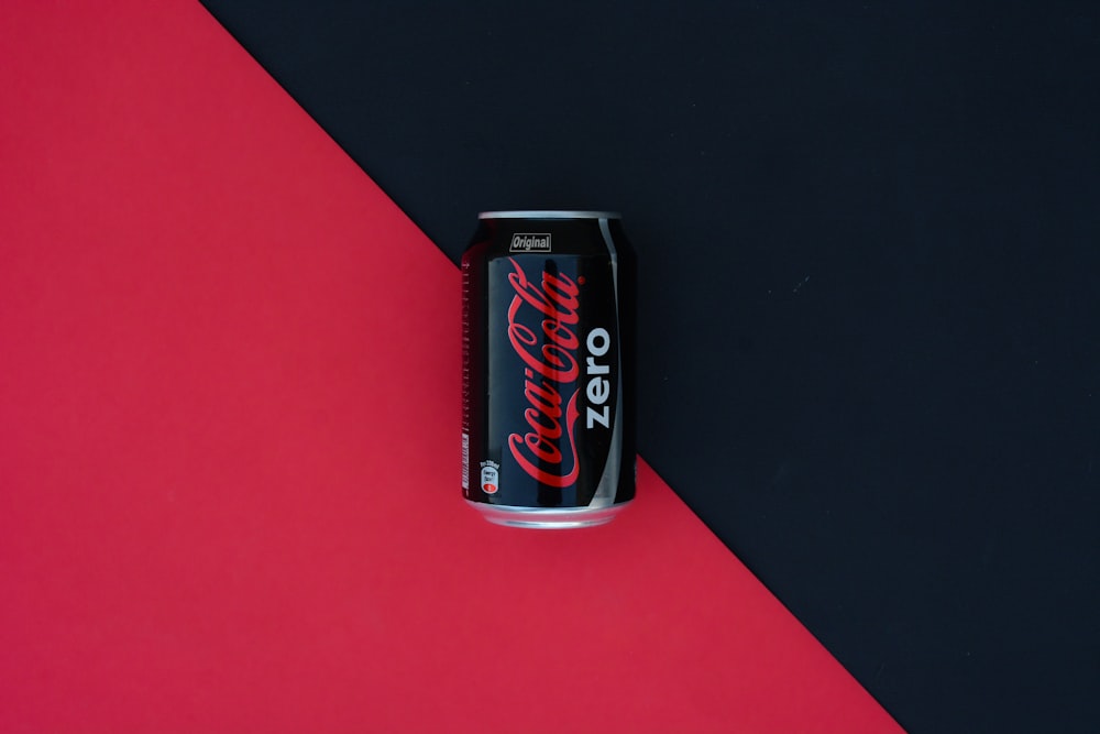 coca cola zero can on red table