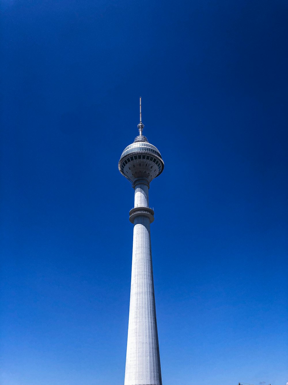 white and blue tower under blue sky during daytime