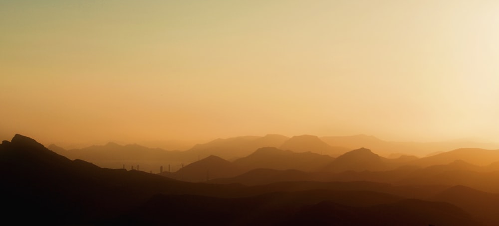 silhouette of mountains during sunset