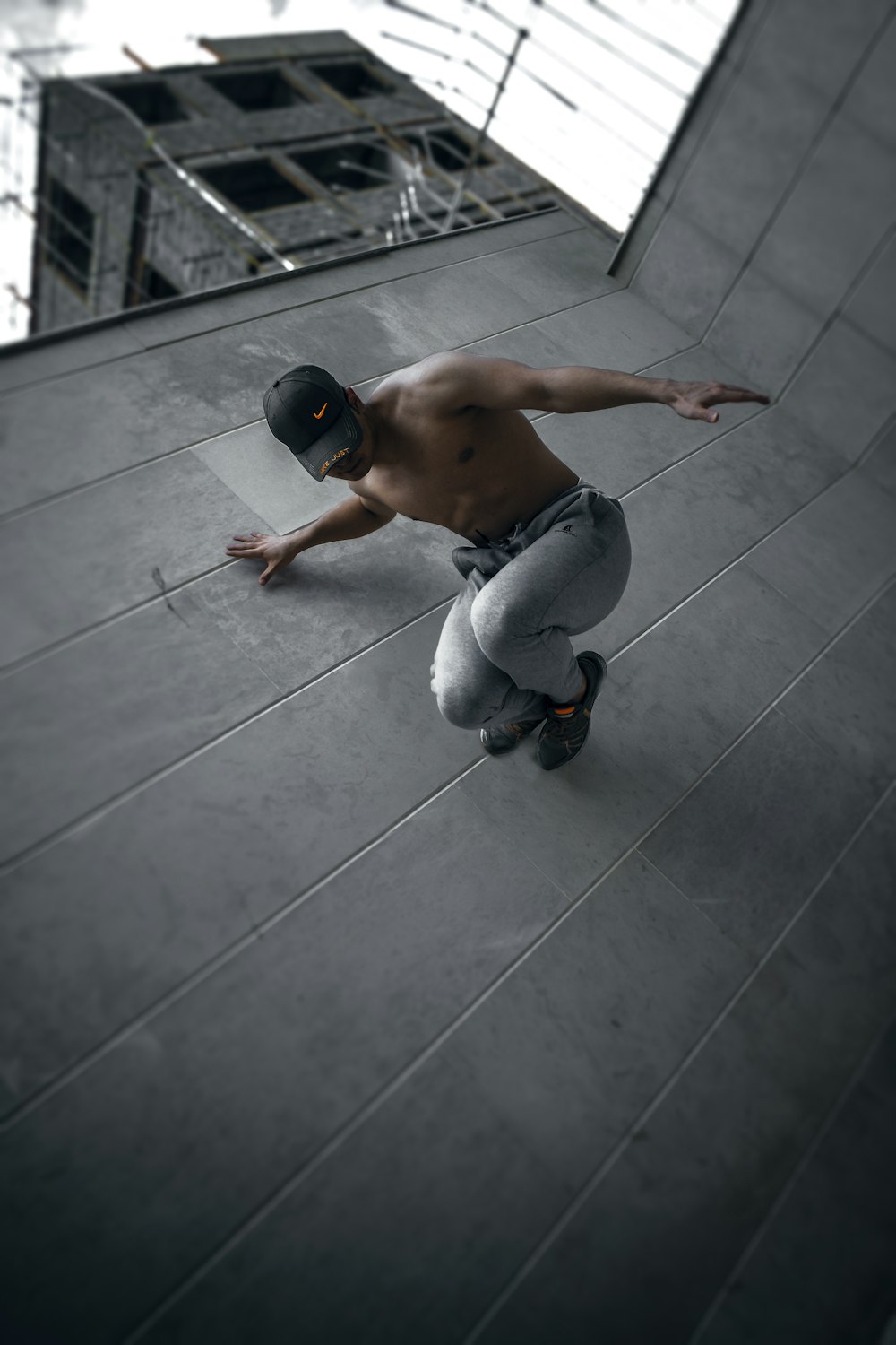 man in blue denim jeans sitting on floor