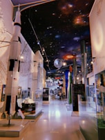 A display of various spacecraft models in a science exhibition.