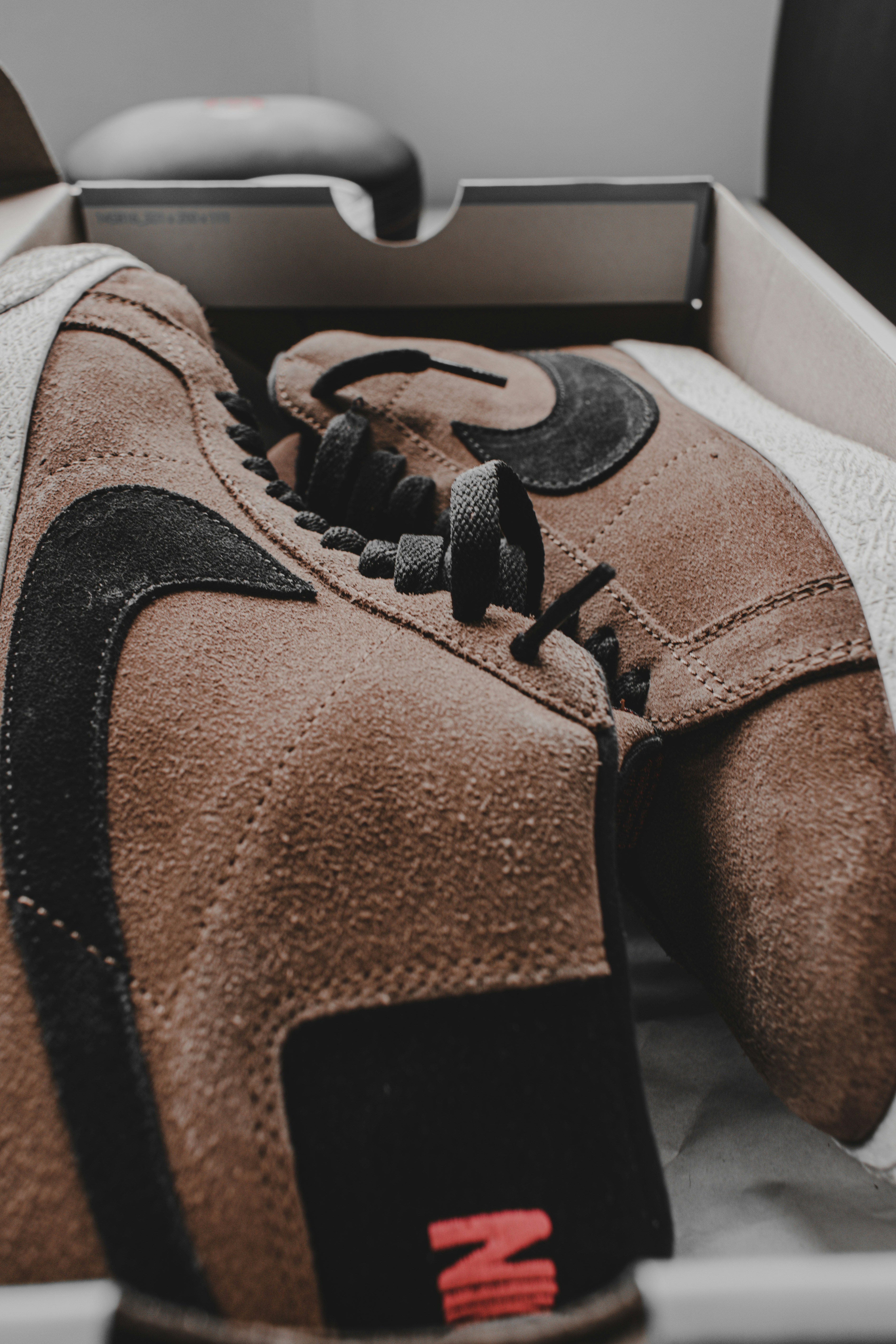 5 Comfortable Shoes That Don’t Sacrifice Style for Long Days on Your Feet – person wearing brown and black hiking shoes