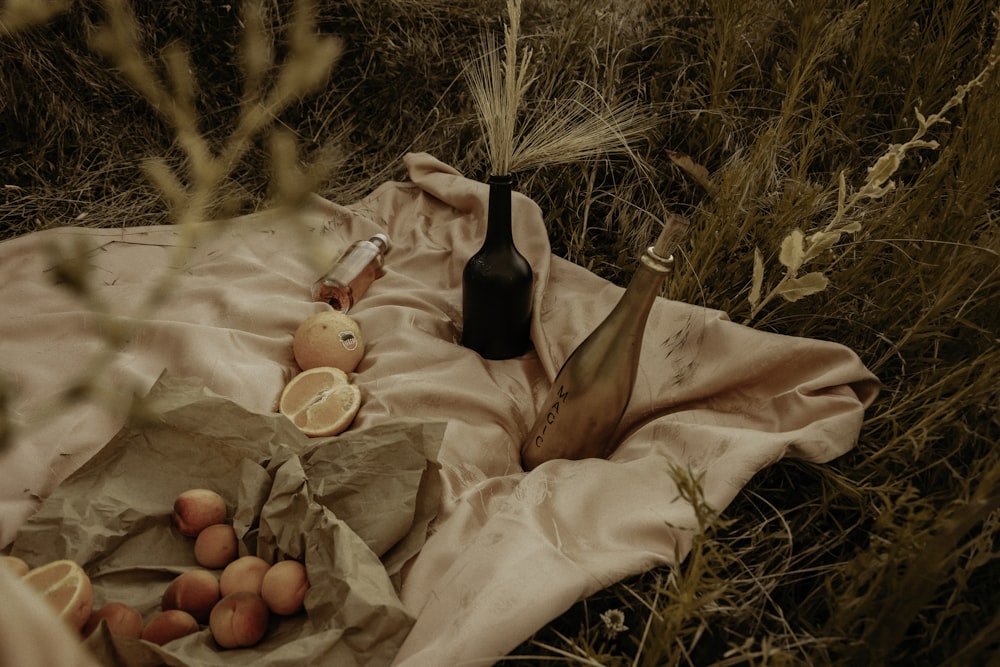 woman in black dress lying on white textile