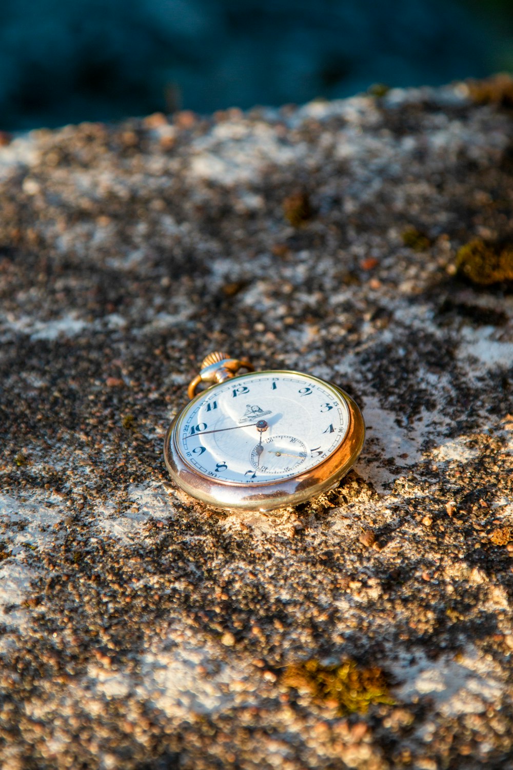 gold and white pocket watch