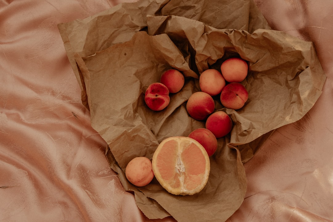 orange fruit on brown paper bag