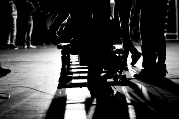 people walking on street in grayscale photography