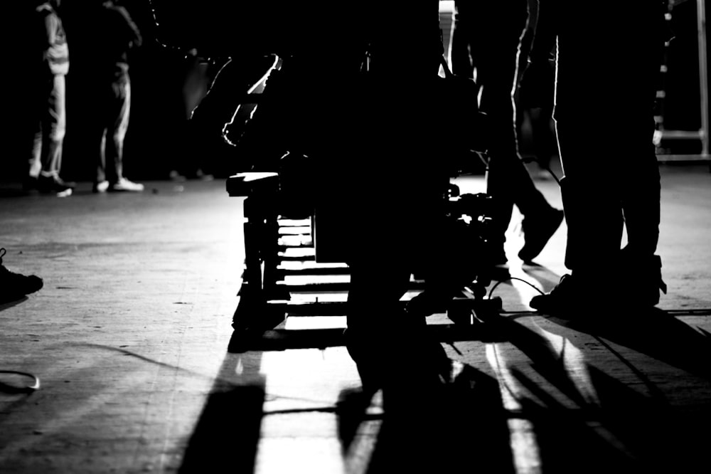 people walking on street in grayscale photography