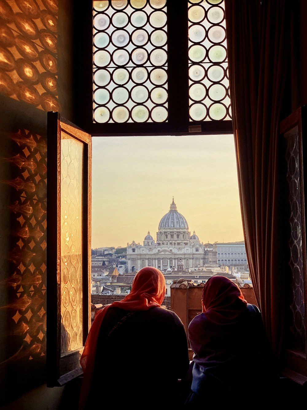 people sitting on chair in front of dome building during daytime