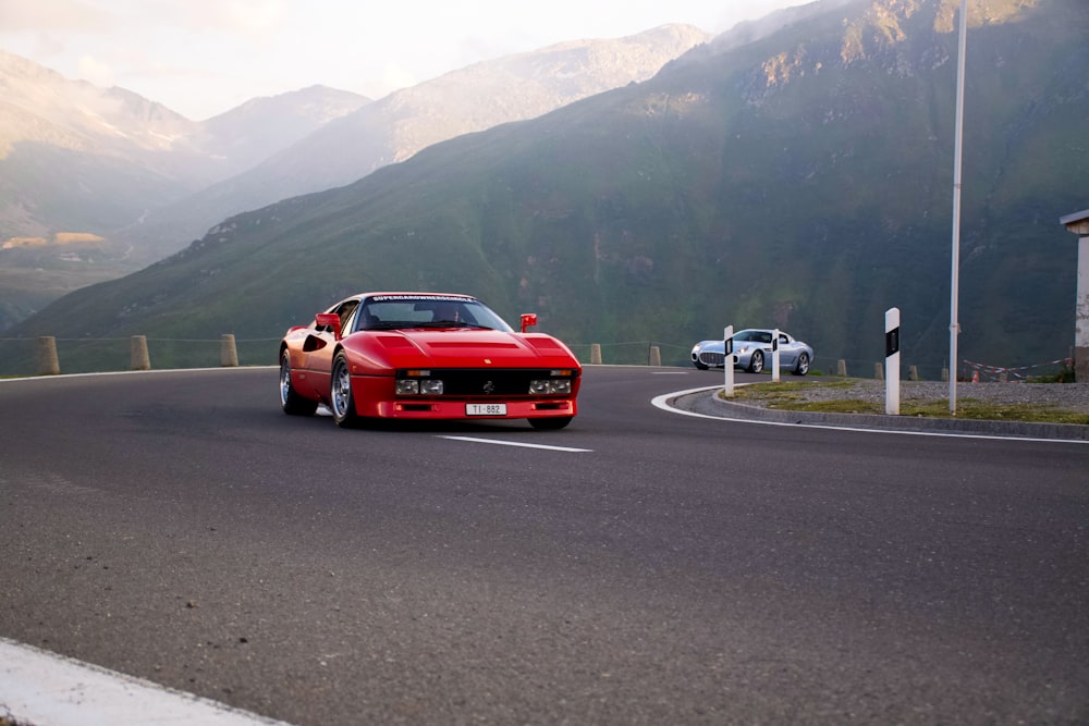 red car on road during daytime