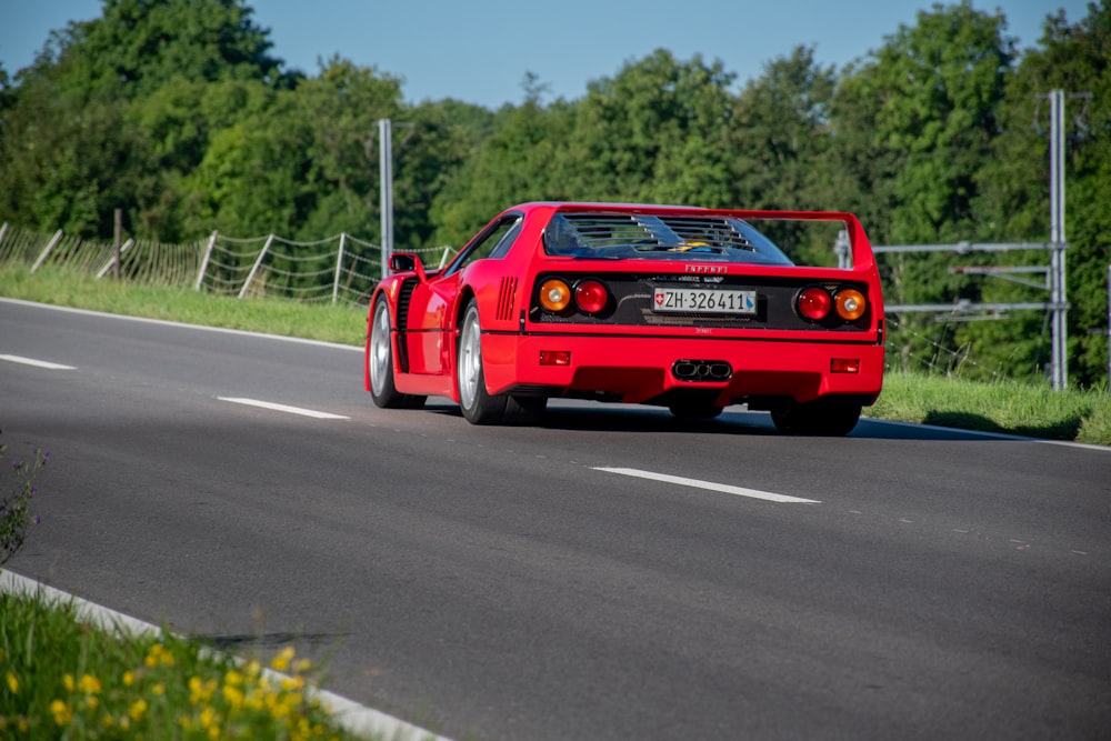 red and white car on road during daytime