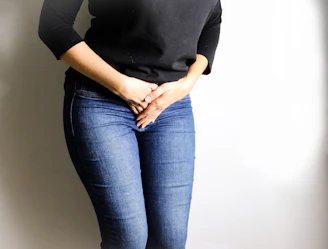 woman in black long sleeve shirt and blue denim jeans