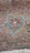 A brick wall covered extensively with chewed gum in various colors, forming a large heart shape outlined in blue. The surface is densely packed with gum pieces, creating a colorful, textured appearance across the entire wall.