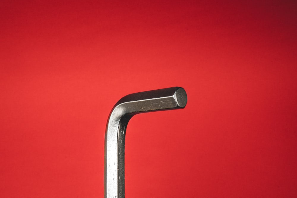 stainless steel handle bar on red background