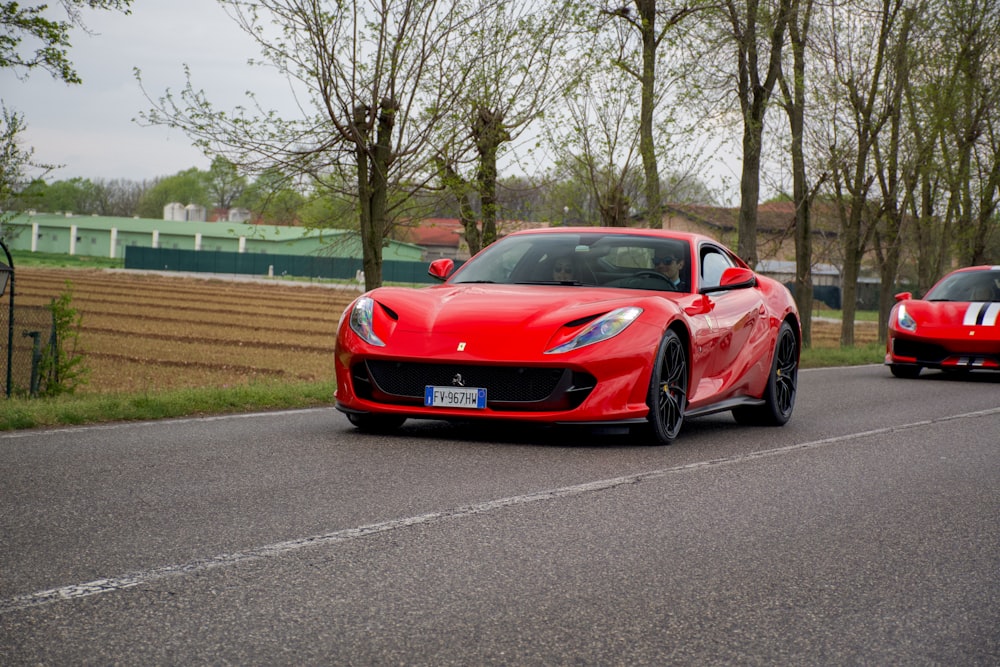 red ferrari 458 italia on road during daytime