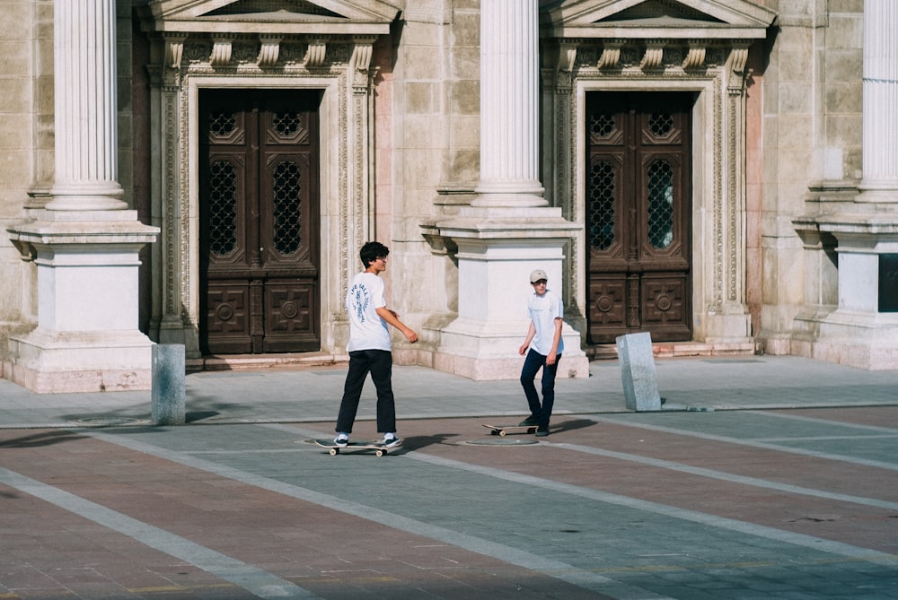 man in white dress shirt and black pants walking on gray concrete floor during daytime