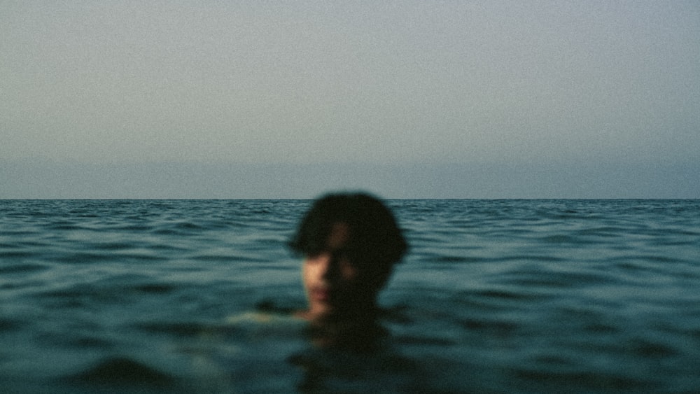 woman in body of water during daytime