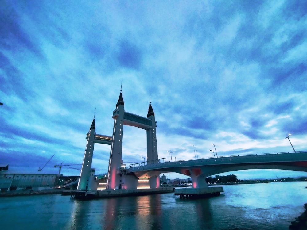 brown bridge under blue sky during daytime