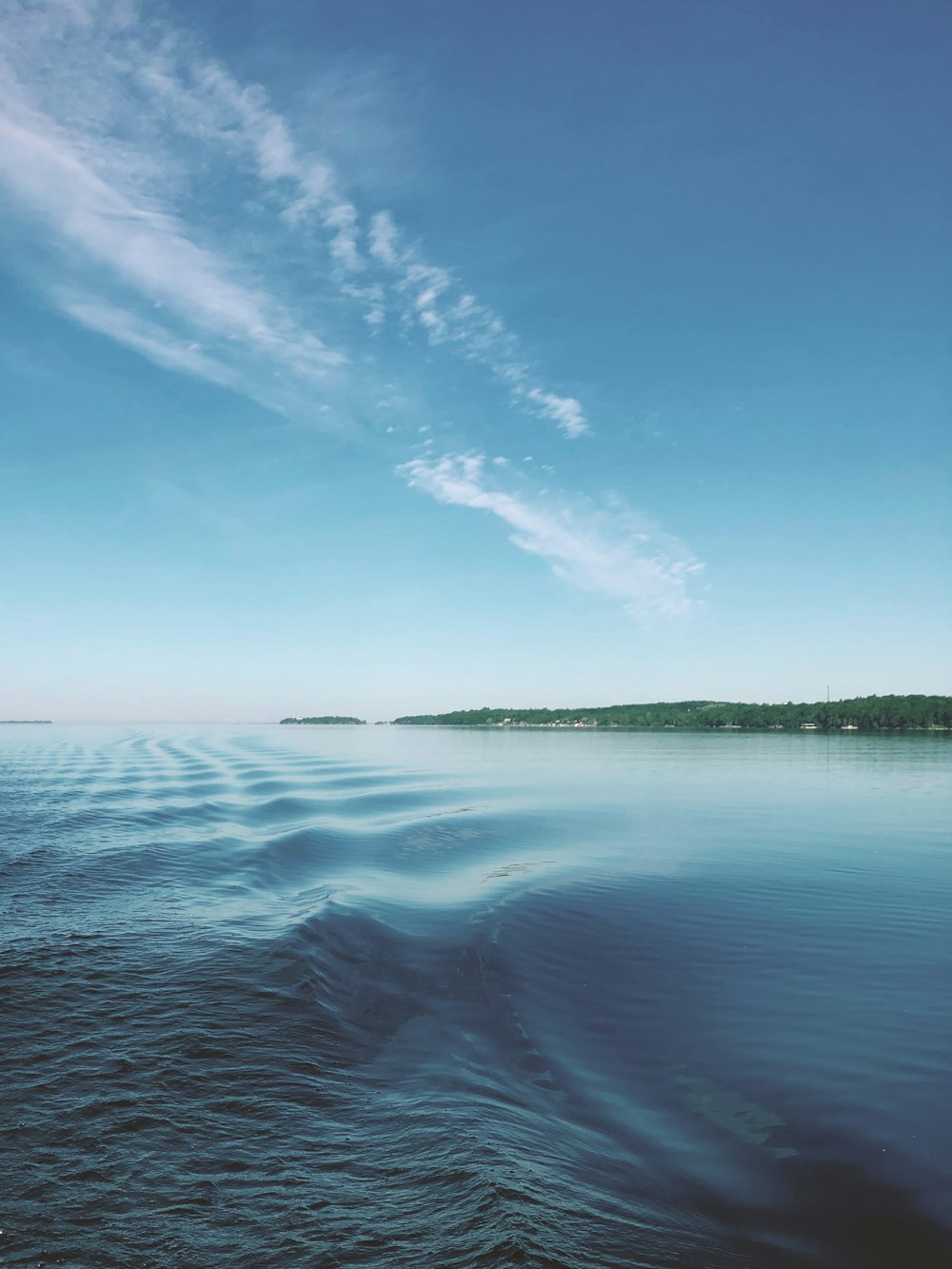 blue sea under blue sky during daytime