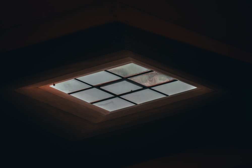 brown wooden framed glass window