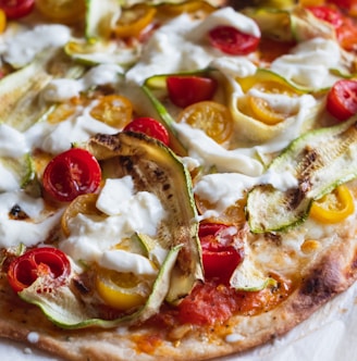 pizza with cheese and green leaves